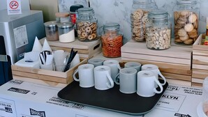 A kitchen counter with various food items, utensils, and a 'No Smoking' sign. - The Chess Hotel (Rayong)