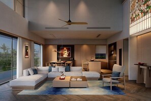 Una sala de estar moderna con un sofá, una mesa de centro y sillas, un comedor y un amplio ventanal con vistas.