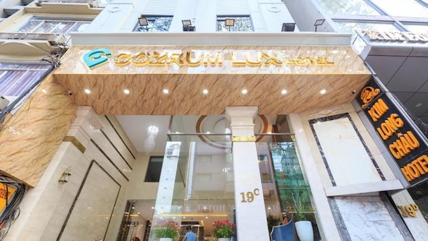 A hotel entrance with a marble facade, a sign reading "Galleria Lux Hotel," and a visible floor number "19C." - Sazi Resin Hotel - Free Nails/hairwash (Ho Chi Minh City)
