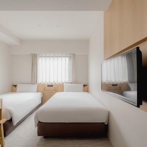 A hotel room with two beds, a large mirror, and a window with curtains. - Hotel Mid in Kuramae Ekimae (Tokyo)