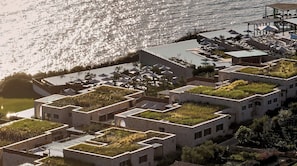 A modern hotel with rooftop gardens, outdoor seating, and a pool. - Lesante Cape Resort & Villas (Zakynthos)