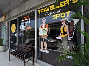 A hotel window with a 'CityIpop' sign, a 'Spot on' sign, and a 'Traveller's Preferred Spot' graphic. - Spot On 89926 City Hostel Ipoh (Ipoh)