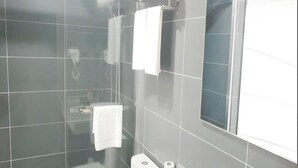A modern bathroom with a glass shower enclosure, a toilet, and a sink. - Thank (Shanghai)