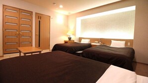 A hotel room with two beds, a desk, a wardrobe, and a large window. - Hotel San Marco (Daito)