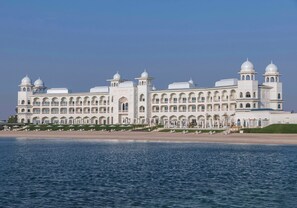 A large, white building with multiple domes and arches, located near a body of water. - The Chedi Katara Hotel and Resort - a GHM Hotel (Doha)
