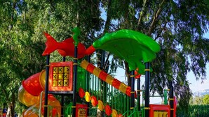 A playground with slides, climbing structures, and a netted area. - Futura Club Acqua Di Venere (Capaccio-Paestum)