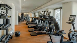 A gym with treadmills, weights, and exercise balls. - Isla Brown Corinthia Resort & Spa, Curio Collection by Hilton (Loutraki-Agioi Theodoroi)