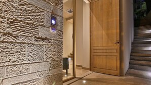 A stone wall with a door and a staircase. - Bono Hotel (Bečići)