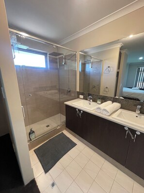 Shower, hair dryer, towels, soap