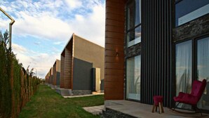 A modern building with large windows and a stone facade. - Kass Diamond Resort (Tsalka)