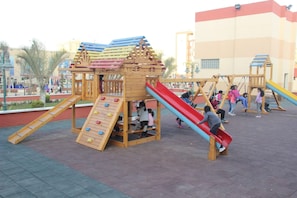 A playground with multiple slides and climbing structures. - Rehana Resort (Cairo)