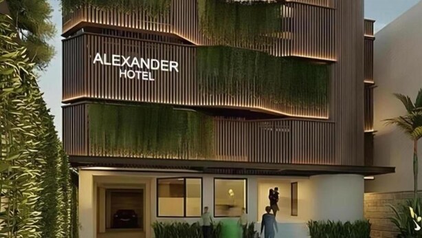 A modern hotel with a prominent sign reading 'ALEXANDER HOTEL.' - Alexander Hotel Tegal (Tegal)