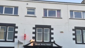 A building with a sign reading 'Grant Arms Hotel' above the entrance. - Grant Arms Hotel (Buckie)