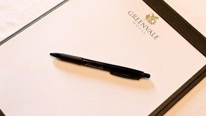 A black pen on a white sheet with 'GREENVALE HOTEL' text and a logo. - Greenvale Hotel (Cookstown)
