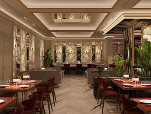 Een ruim restaurant met hoge plafonds, moderne verlichting en een visgraat vloerpatroon.
