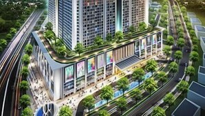A high-rise building with a modern design, featuring a prominent glass facade and a rooftop garden. - LK Hotel Chadstone Cikarang (Cikarang)