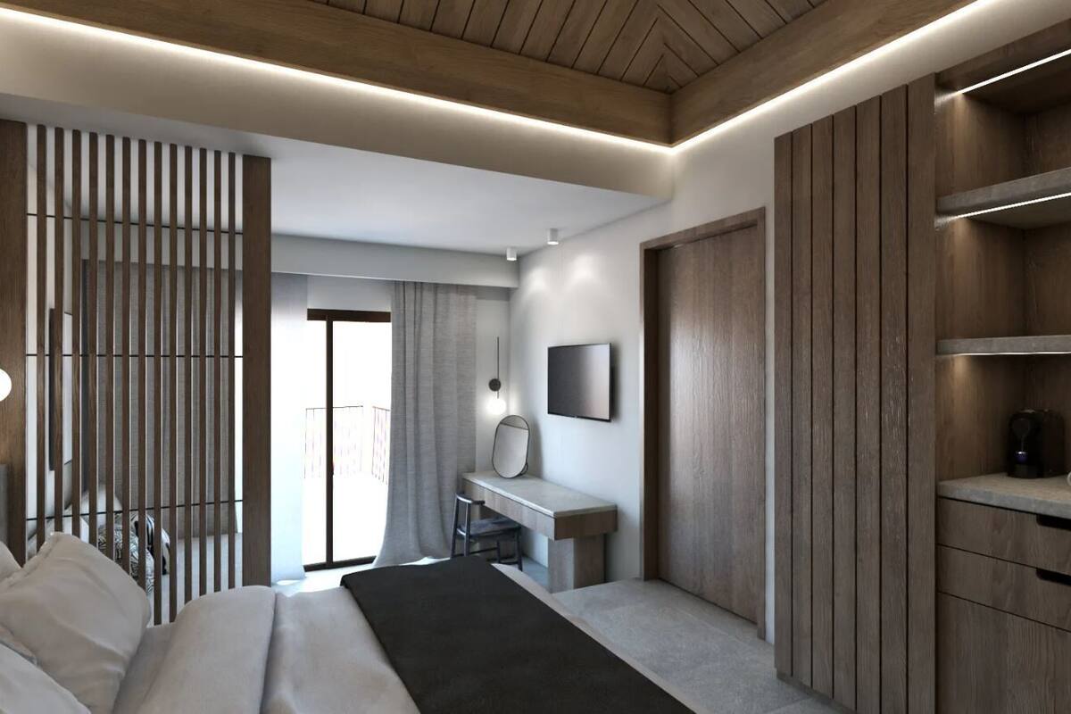 A modern bedroom with a bed, desk, and wardrobe.