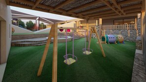 A children's play area with a swing set, climbing structures, and a slide.