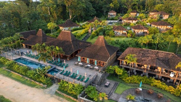 A resort with multiple bungalow-style buildings, a swimming pool, and a well-maintained garden. - La Coralina Island House -only Adults (Bocas del Toro)