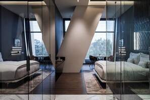 A modern hotel room with two beds, a glass partition, and a view of the outdoors. - Hotel Alexander (Mexico City)