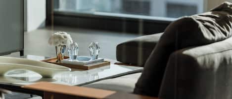 A modern living room with a sofa, a coffee table, and decorative items.
