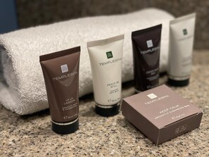 A collection of toiletries including a shower gel, a cleansing bar, and a box of a cleansing bar. - Hex Wildlife Hotel At Yorkshire Wildlife Park (Doncaster)