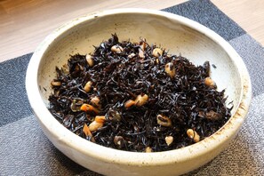 A bowl of dark-colored food with nuts and possibly some vegetables. - Kyoto Plaza Hotel Kintetsu Jujo (Kyoto)
