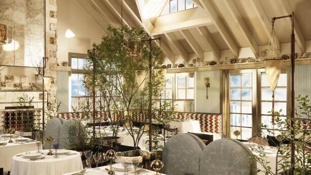 A restaurant with round tables, chairs, and hanging plants. - Baron's Cove (Sag Harbor)