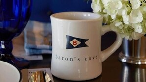 A white mug with a logo and text reading "baron's cove." - Baron's Cove (Sag Harbor)