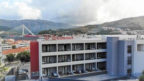 A hotel with a modern design, featuring multiple balconies and a view of the surrounding landscape. - D-elegant Lapad Dubrovnik (Dubrovnik)