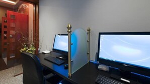 A modern office space with two desktop computers, a black office chair, and a decorative plant. - Hotel Z Palace and Congress Center (Xanthi)