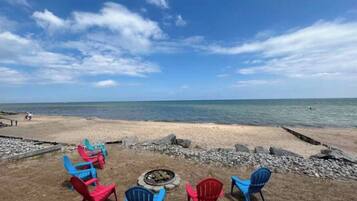 On the beach, sun loungers, beach towels