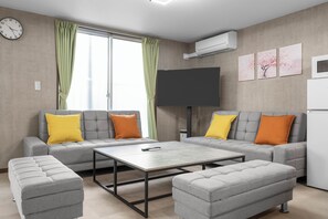 50-inch Smart TV with cable channels, Netflix, streaming services - Smart Stay Inn (Osaka)