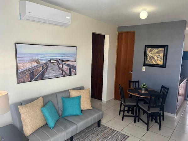 TV, books - Casa María 2BR Apt with terrace (Toa Baja)