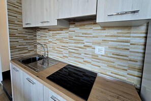 Fridge, stovetop, coffee/tea maker, dining tables