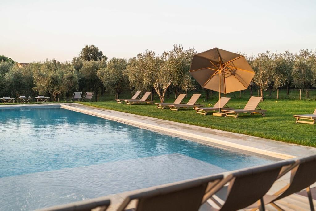 Seasonal outdoor pool, pool umbrellas, pool loungers