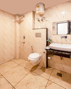 Shower, slippers, towels, soap - Hotel Tark Suite Near IGI Airport Delhi  (New Delhi)