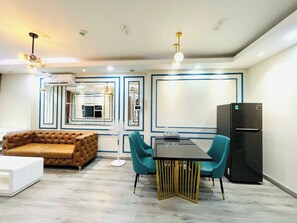 Family Apartment, Balcony, Pool View | Living area | 55-inch Smart TV with digital channels - LaLa Tan Son Nhat Airport Skycenter (Tan Binh)