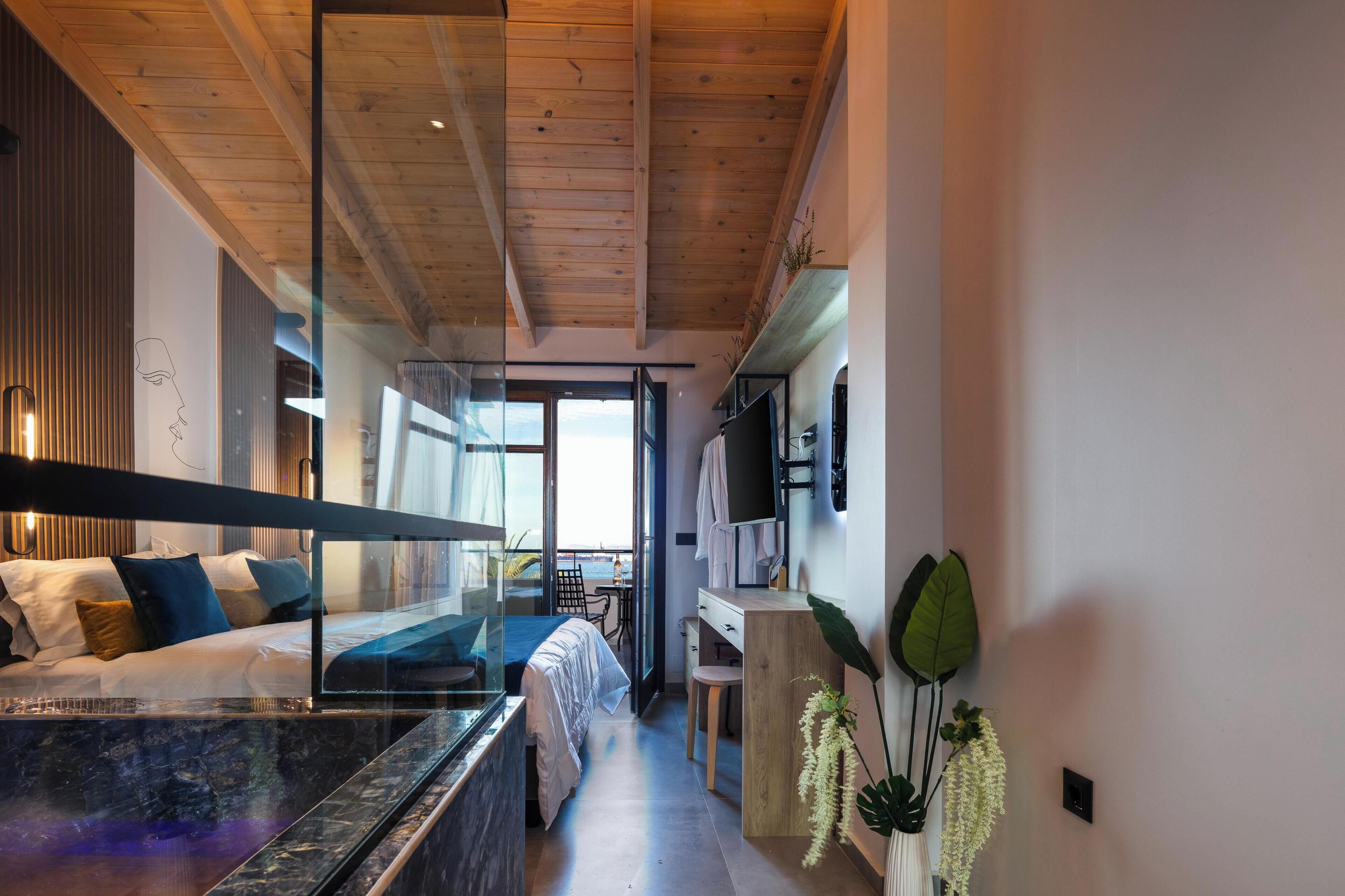 Suite, 2 Bathrooms, Sea View | Hypo-allergenic bedding, in-room safe, laptop workspace, blackout drapes