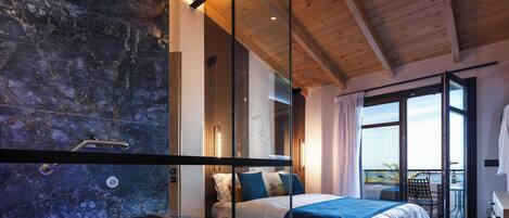 Suite, 2 Bathrooms, Sea View | Hypo-allergenic bedding, in-room safe, laptop workspace, blackout drapes