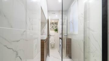 Shower, hair dryer, towels, soap