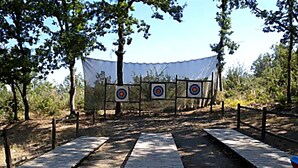 An outdoor archery range with targets and a wooden pathway. - Orama Hotel - Lake Plastira Fireplace Suite (Lake Plastiras)