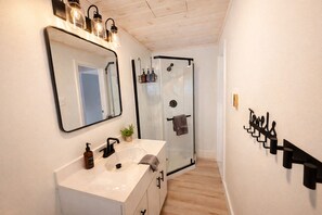 Shower, hair dryer, towels, soap