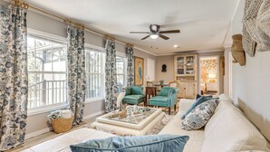 A living room with a sofa, two armchairs, a coffee table, and a ceiling fan. - Riverfront Oasis: Fish, Grill & Chill in Stuart! (Stuart)