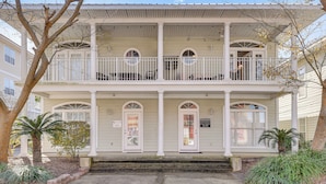A two-story building with a balcony, a front door, and a sign that reads "Perseverance." - Walkable Dtwn Fort Walton Beach Condo w/ Balcony! (Fort Walton Beach)