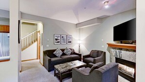 A living room with a sofa, armchairs, a coffee table, a fireplace, and a TV. - Whistler - Northstar 93 (Whistler)
