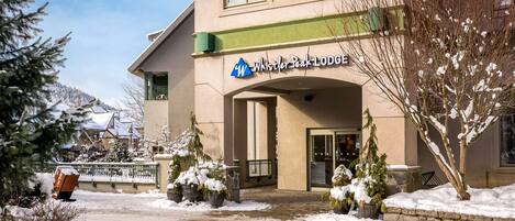 A building with a sign reading 'Whistler Peak Lodge.'