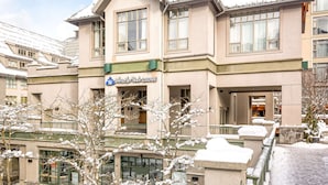 A hotel with a sign reading "Whistler Peak Lodge" and a snow-covered exterior. - Whistler - Whistler Peak Lodge 4402 (Whistler)