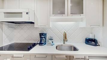 Fridge, microwave, coffee/tea maker, toaster