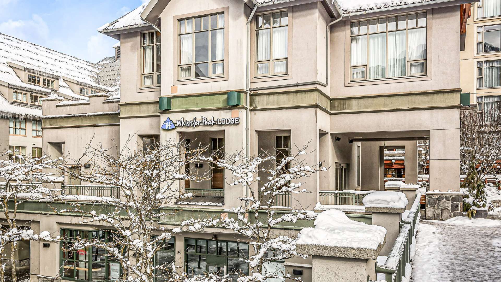 A building with a sign reading "Whistler Peak Lodge".
